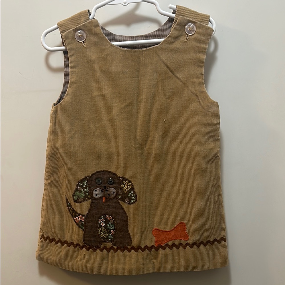 Vintage corduroy dress. Light brown pinnie buttons at the top, dog bone overlay